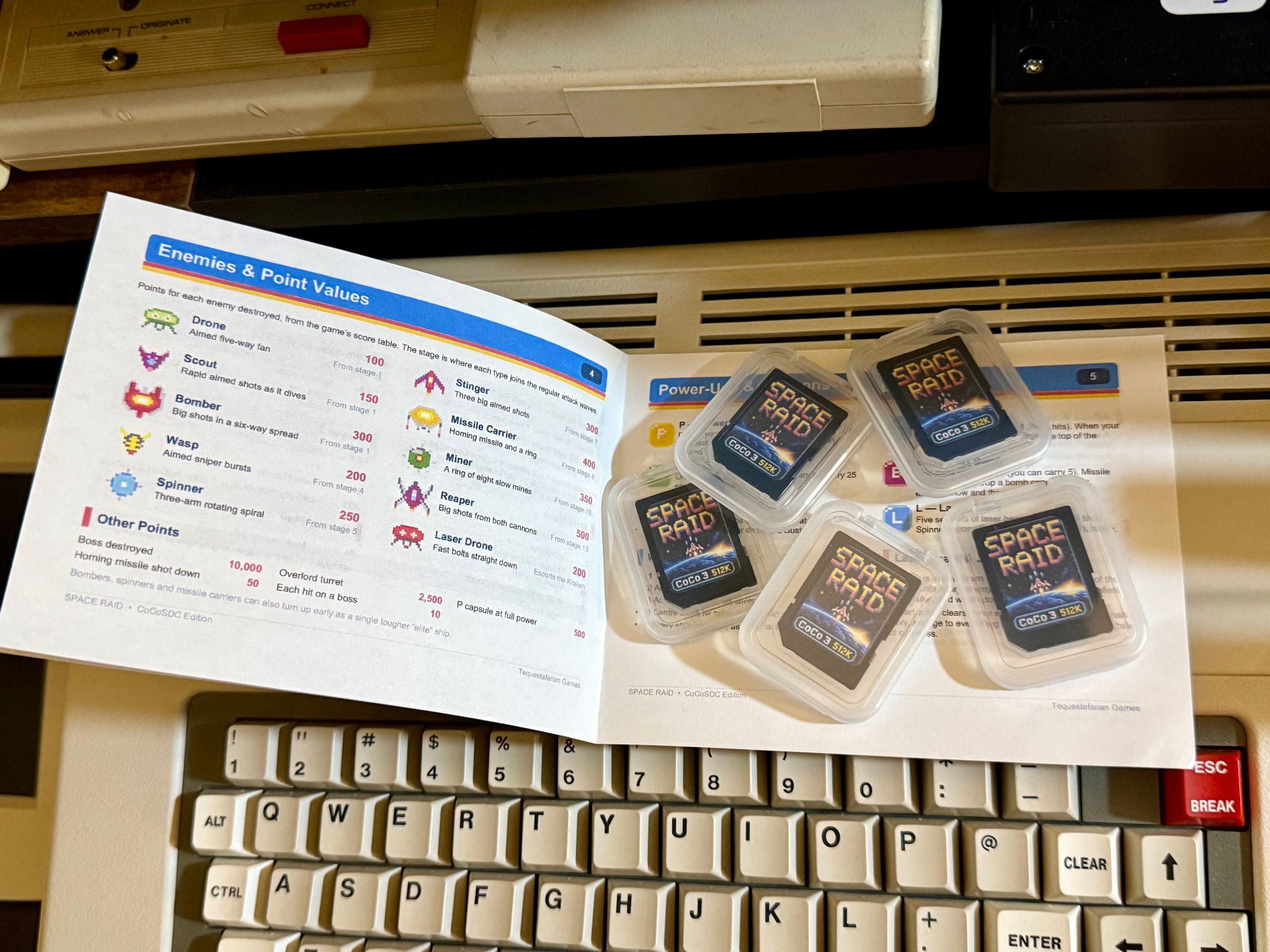 Space Raid CoCoSDC Edition SD cards arranged on the open printed manual