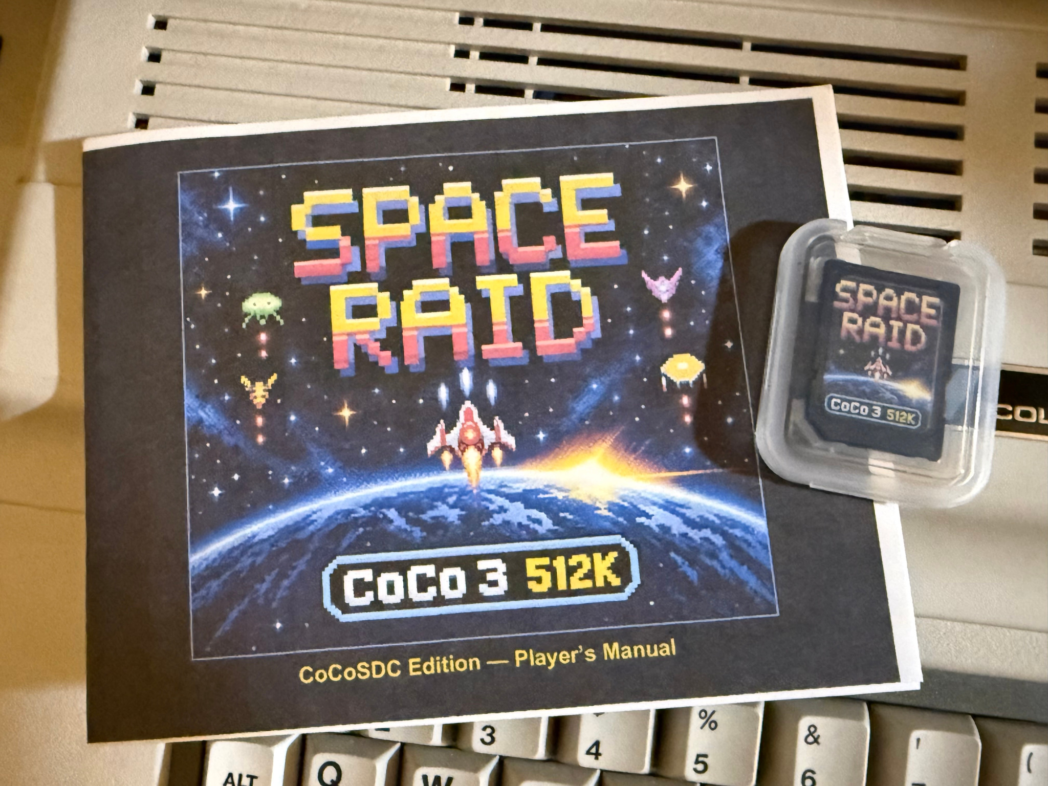 Space Raid CoCoSDC Edition manual and labeled SD card in its protective case